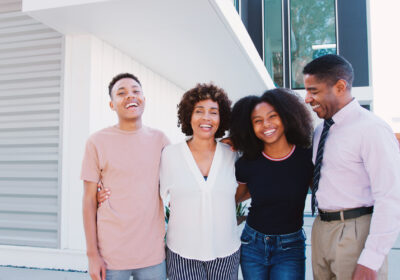 portrait-of-smiling-family-with-older-children-sta-2025-12-15-07-57-27-utc